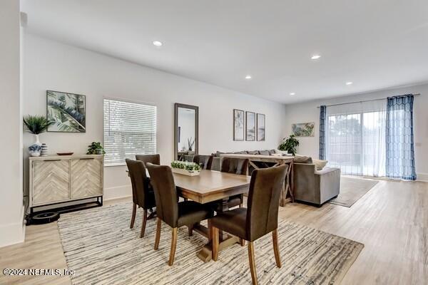 3081 Pullian Court Jacksonville Beach, FL 32250 - Photo 7 of 56 a view of a dining room with furniture and wooden floor