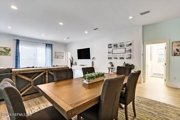 3081 Pullian Court Jacksonville Beach, FL 32250 - Photo 9 of 56 a view of a dining room with furniture and wooden floor
