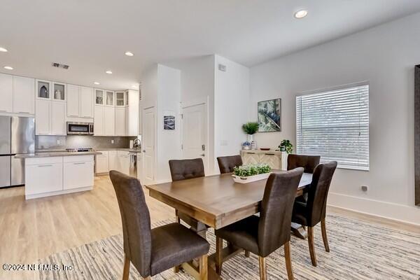 3081 Pullian Court Jacksonville Beach, FL 32250 - Photo 10 of 56 a view of a dining room with furniture and wooden floor