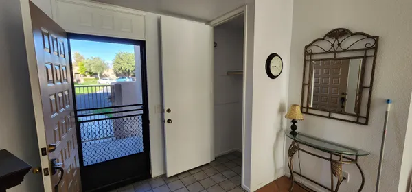 a view of front door with wooden door