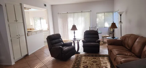 a living room with furniture and a window