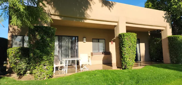 a view of a back yard with a green space