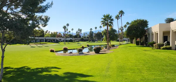 a view of a golf course with the garden