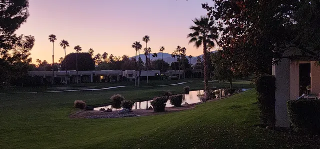 a garden view with a lake view