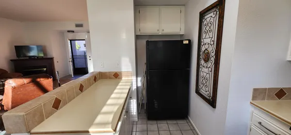 a view of a hallway with furniture and entryway