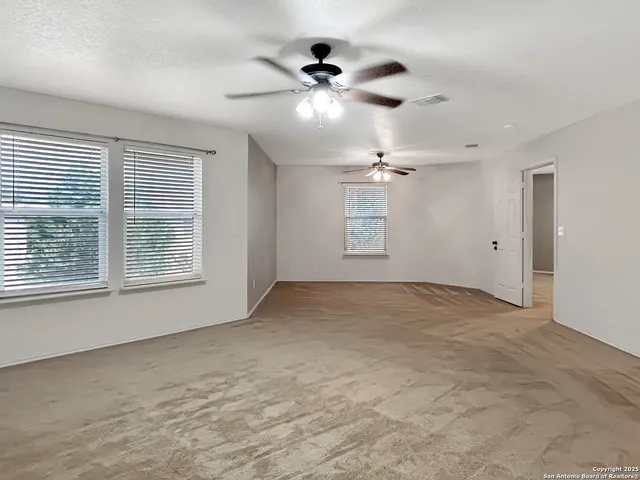 a view of an empty room with a window
