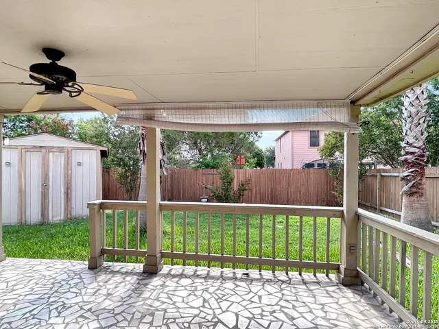 a view of a house with backyard and porch