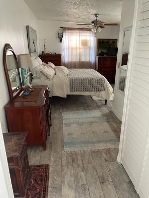 3920 Edwards Road Fort Pierce, FL 34981 - Photo 11 of 14 a bedroom with a bed window and a fireplace