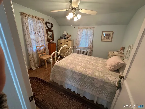 a bathroom with a toilet sink and a mirror