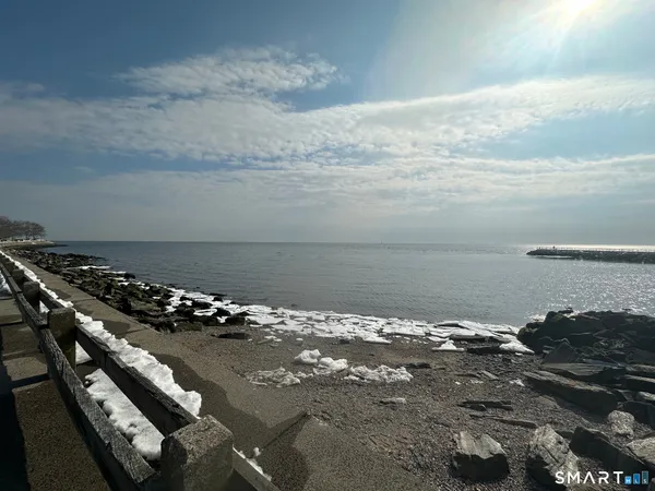 a bedroom with bed and a chandelier