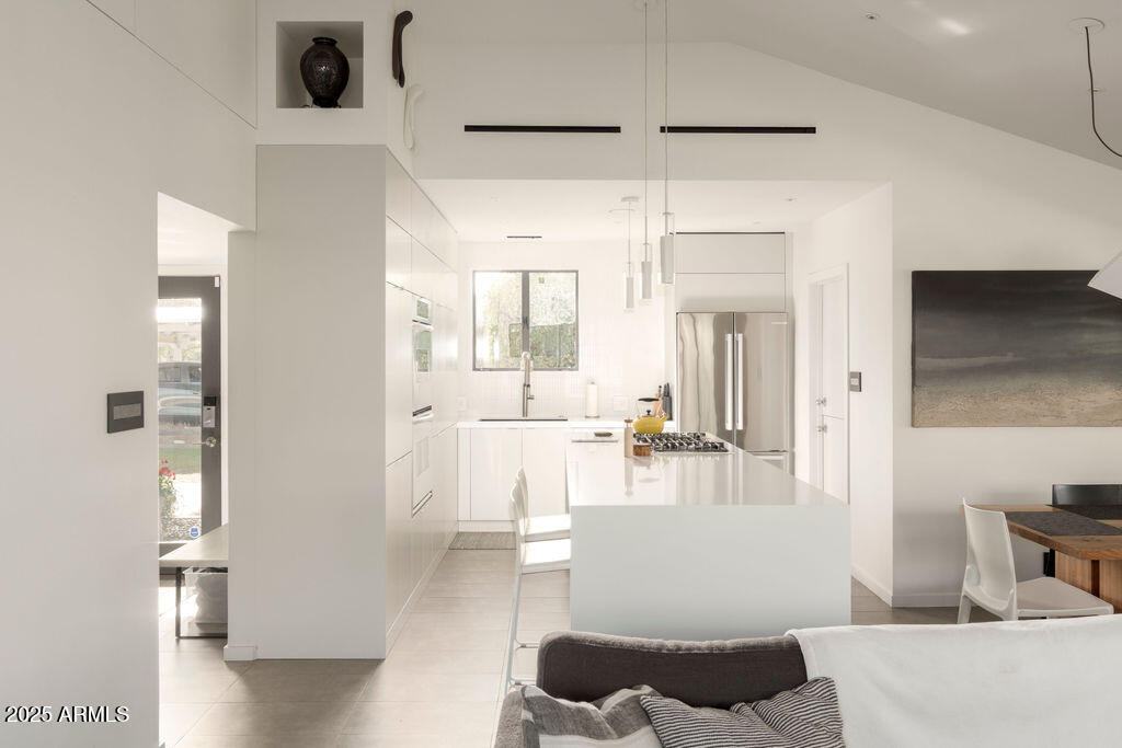 4530 North 9th Avenue Phoenix, AZ 85013 - Photo 11 of 35 a living room with furniture and a table