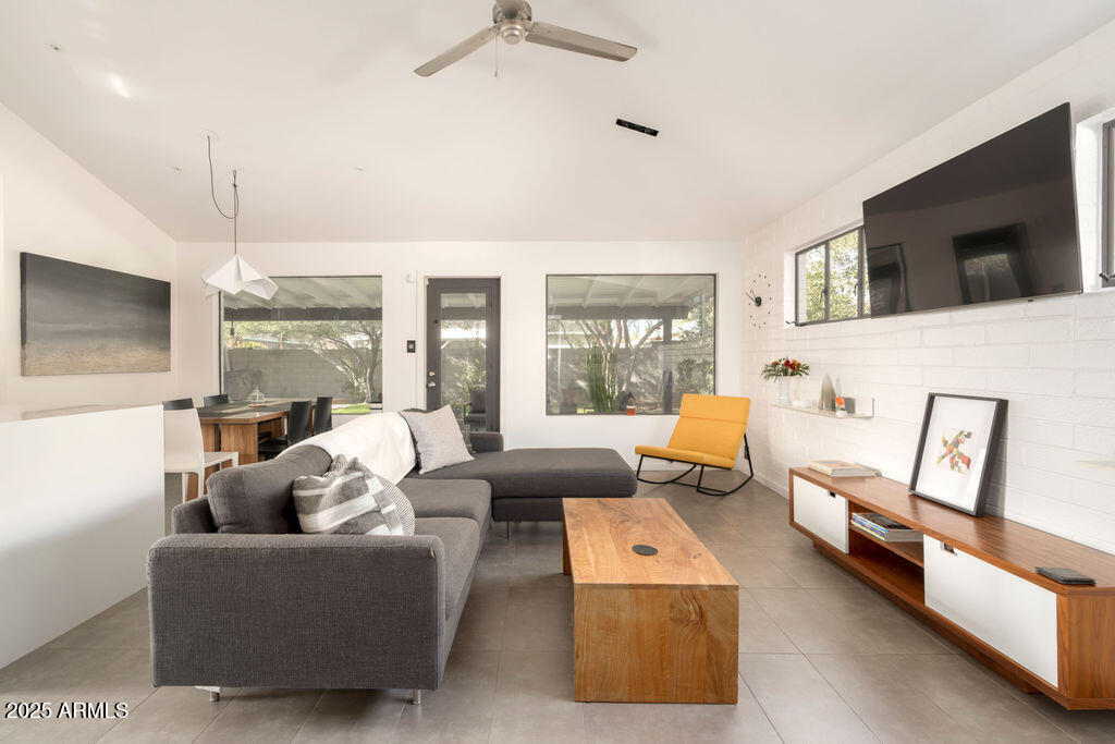 4530 North 9th Avenue Phoenix, AZ 85013 - Photo 17 of 35 a living room with furniture and a flat screen tv