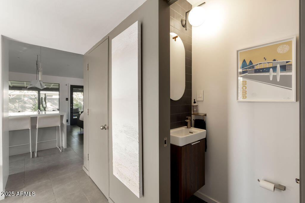 4530 North 9th Avenue Phoenix, AZ 85013 - Photo 19 of 35 a bathroom with a sink and a mirror