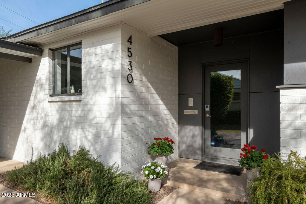 4530 North 9th Avenue Phoenix, AZ 85013 - Photo 2 of 35 a front view of a house with a porch