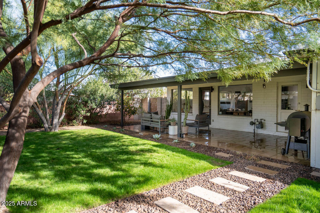4530 North 9th Avenue Phoenix, AZ 85013 - Photo 23 of 35 a view of a house with a yard porch and sitting area