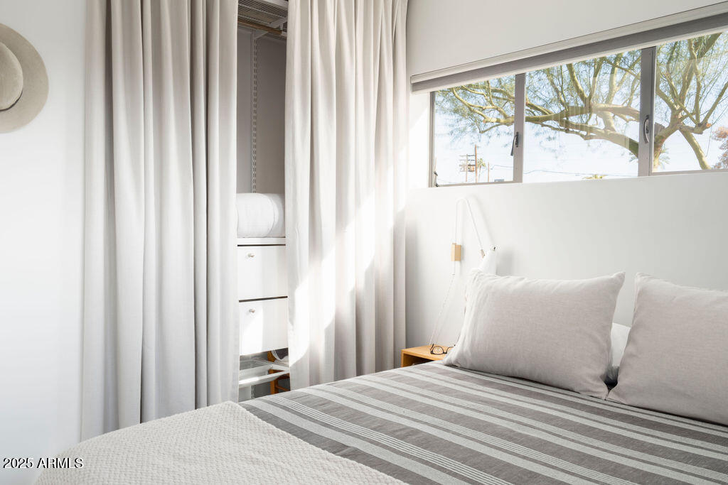 4530 North 9th Avenue Phoenix, AZ 85013 - Photo 29 of 35 a bedroom with a bed and a large window with outer view