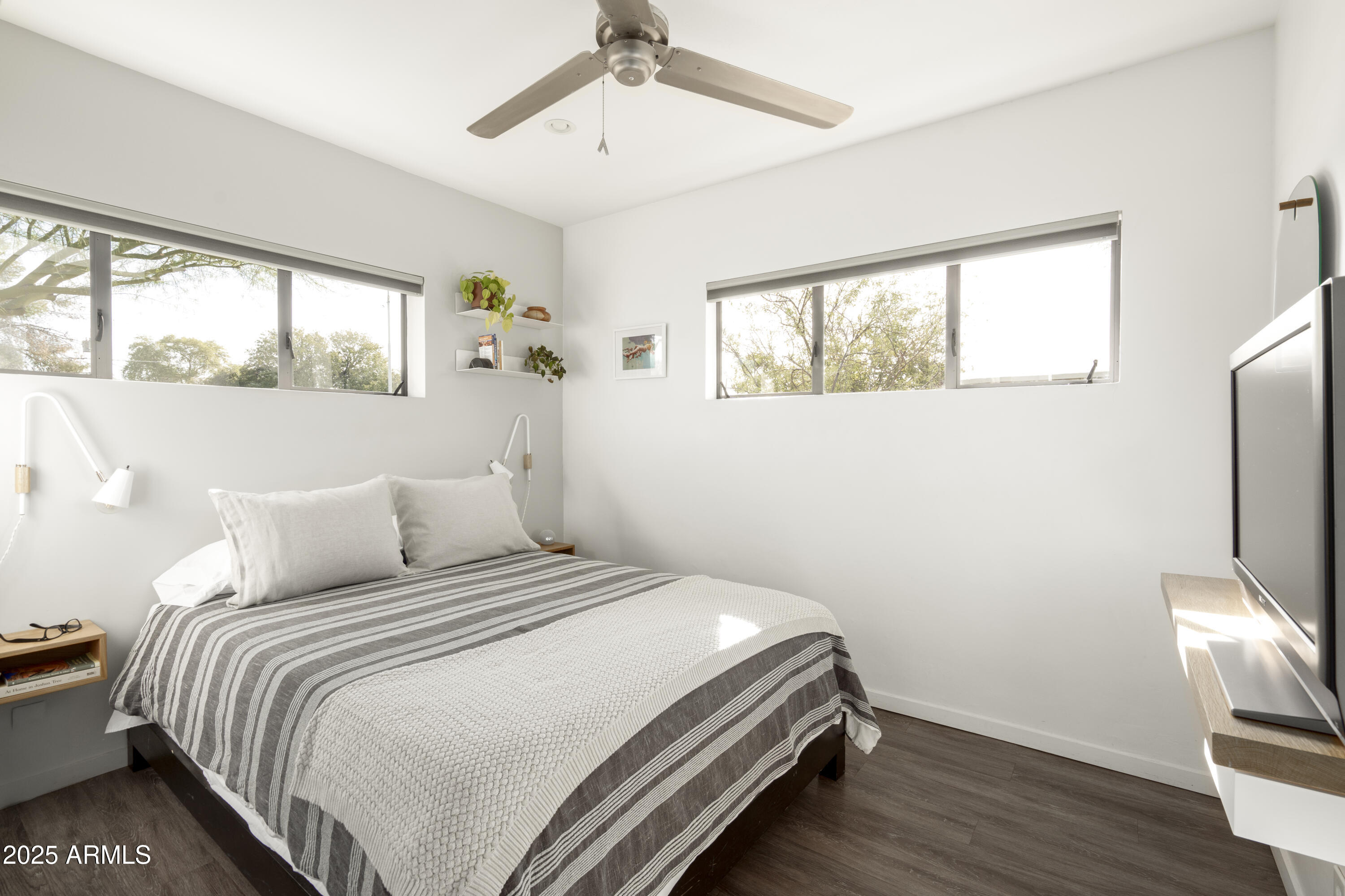 4530 North 9th Avenue Phoenix, AZ 85013 - Photo 30 of 35 a bedroom with a bed wooden floor and window