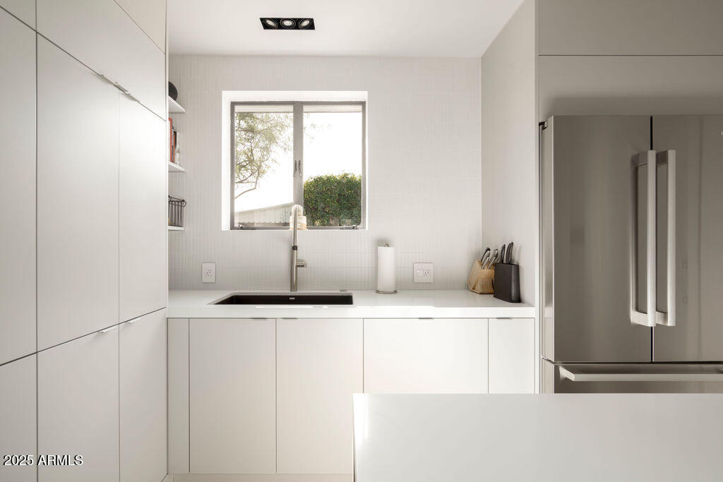 4530 North 9th Avenue Phoenix, AZ 85013 - Photo 8 of 35 a bathroom with a sink and a mirror