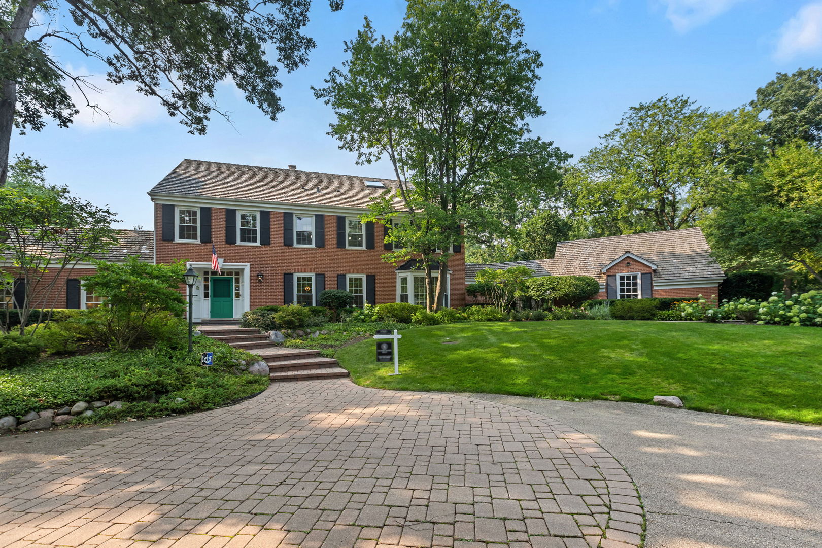 209 North Green Bay Road Lake Forest, IL 60045 - Photo 1 of 51 a front view of a house with a garden