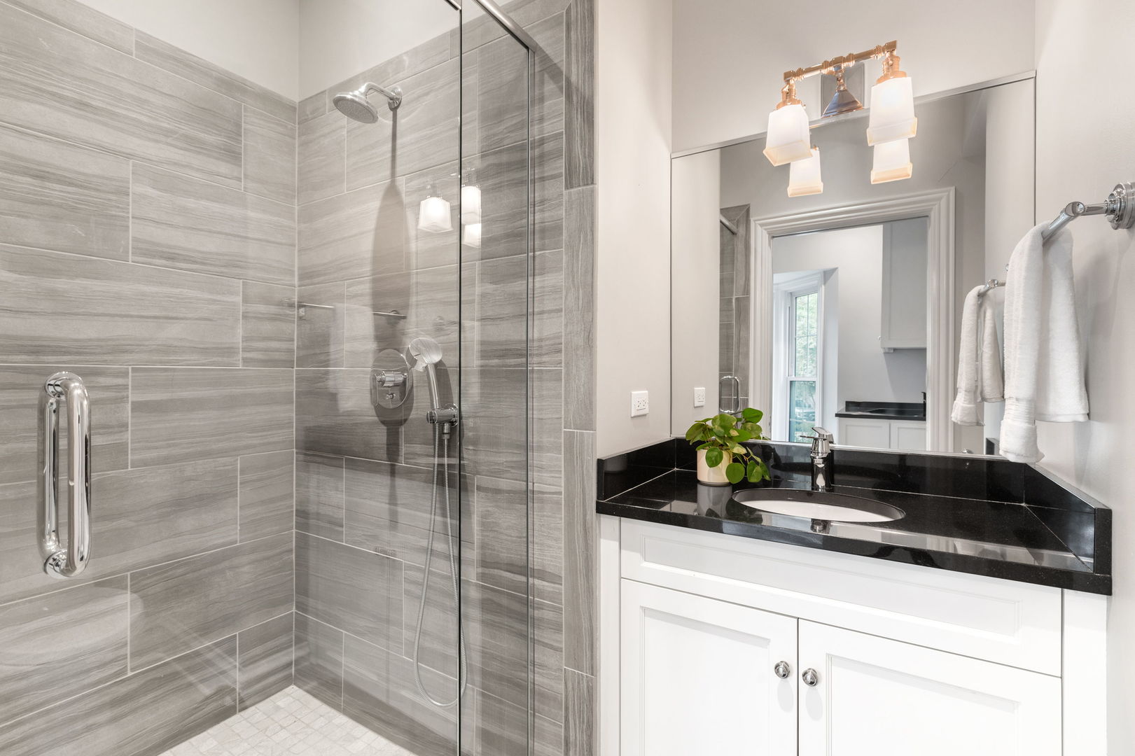 209 North Green Bay Road Lake Forest, IL 60045 - Photo 26 of 51 a bathroom with a sink and a mirror