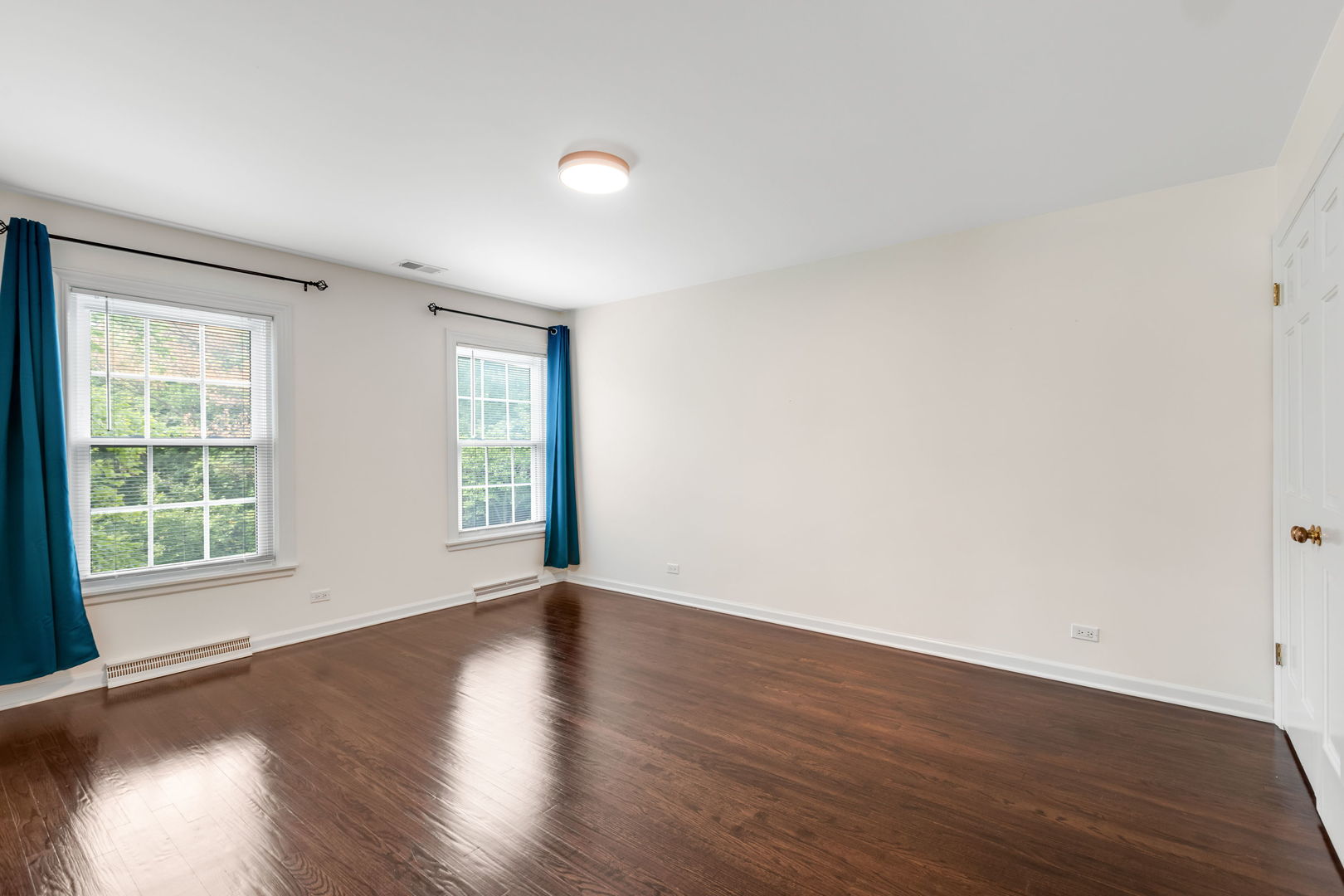 209 North Green Bay Road Lake Forest, IL 60045 - Photo 35 of 51 an empty room with wooden floor and windows