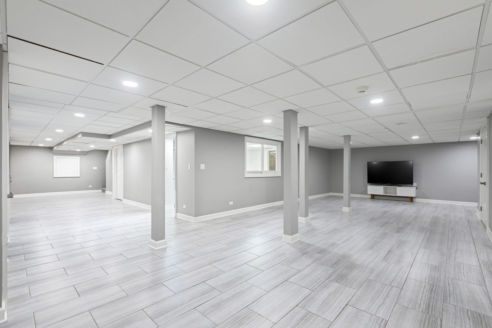 209 North Green Bay Road Lake Forest, IL 60045 - Photo 39 of 51 a view of a livingroom with a flat screen tv wooden floor and a window