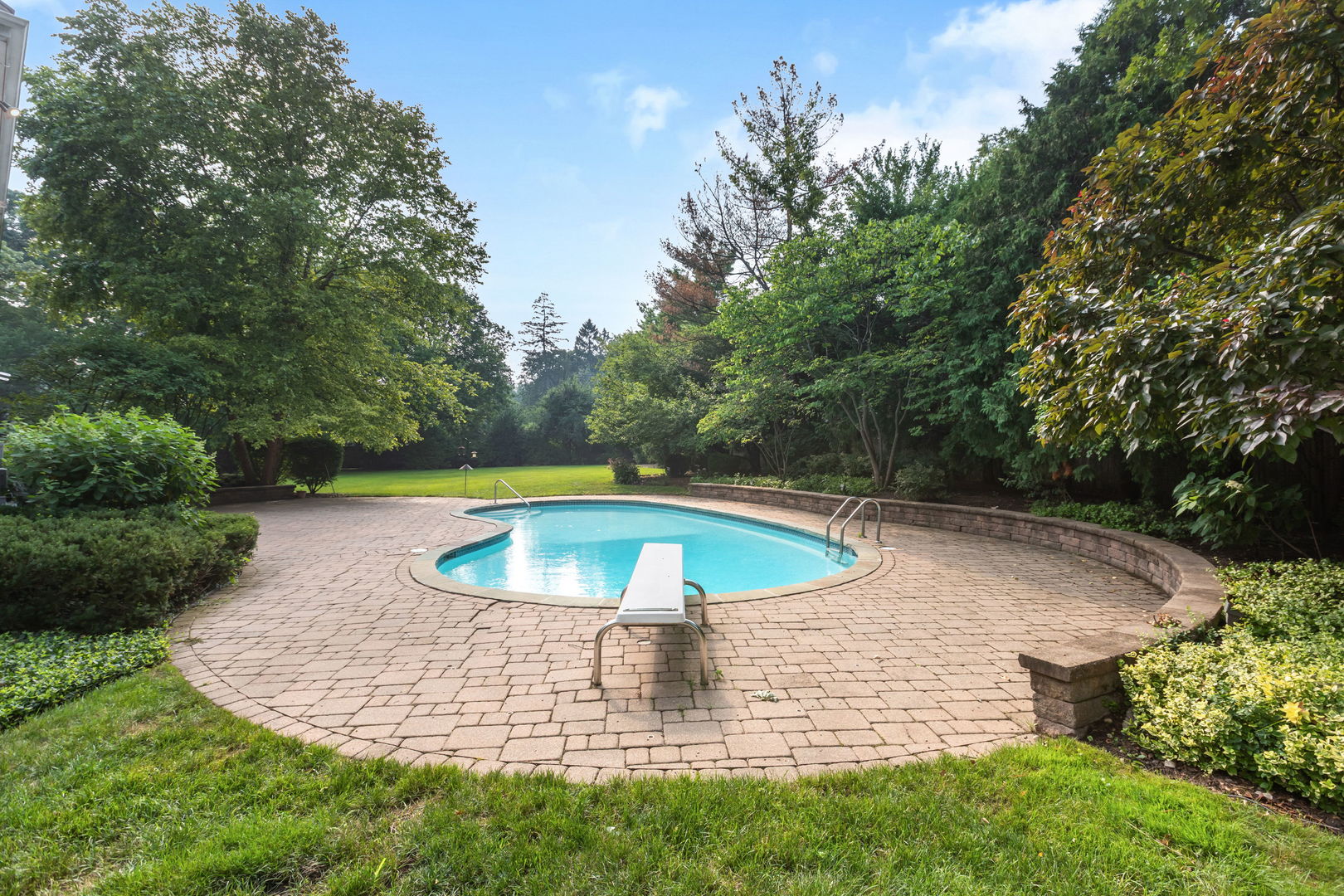209 North Green Bay Road Lake Forest, IL 60045 - Photo 43 of 51 a view of a swimming pool with a yard