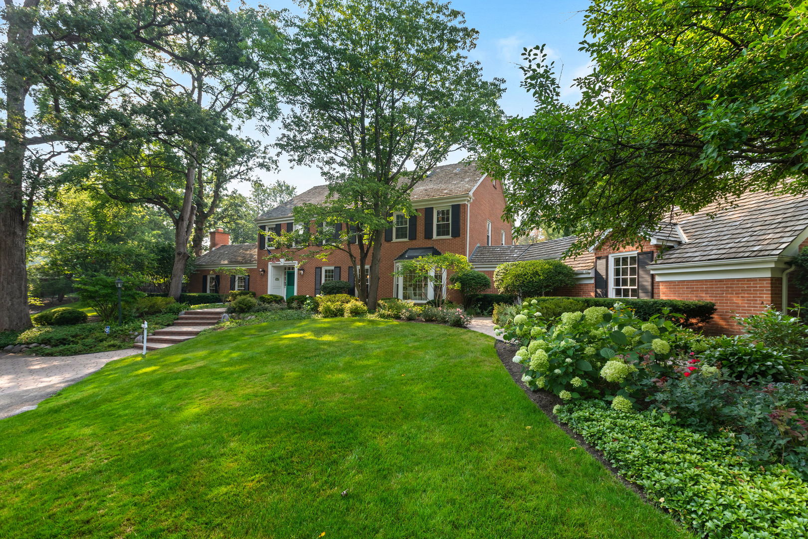209 North Green Bay Road Lake Forest, IL 60045 - Photo 45 of 51 a front view of a house with a garden and plants