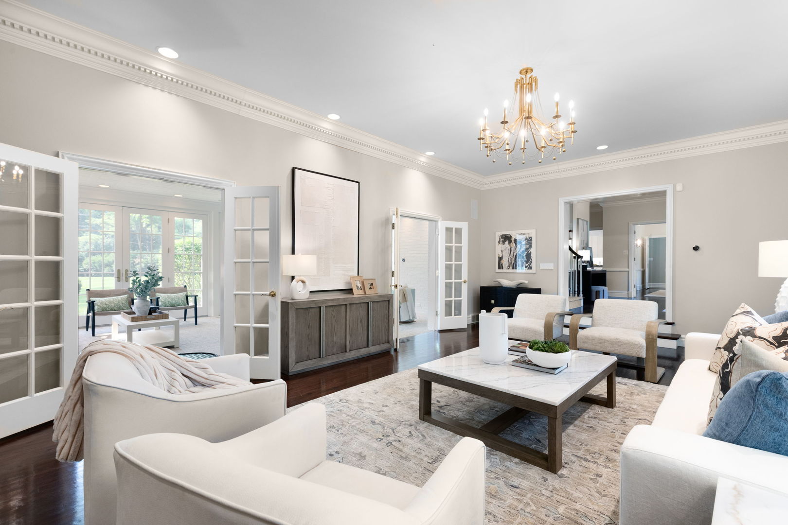 209 North Green Bay Road Lake Forest, IL 60045 - Photo 5 of 51 a living room with furniture a chandelier a rug and a chandelier