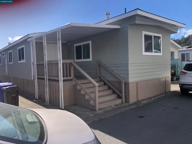 a view of a house with wooden floor and a sink