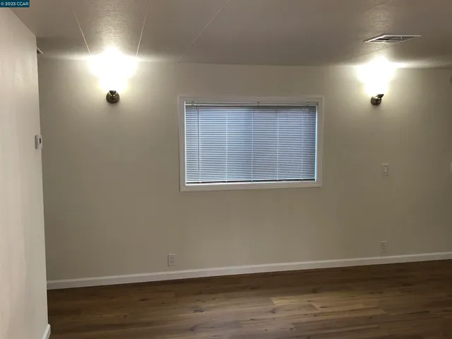 a view of house with outdoor space and parking