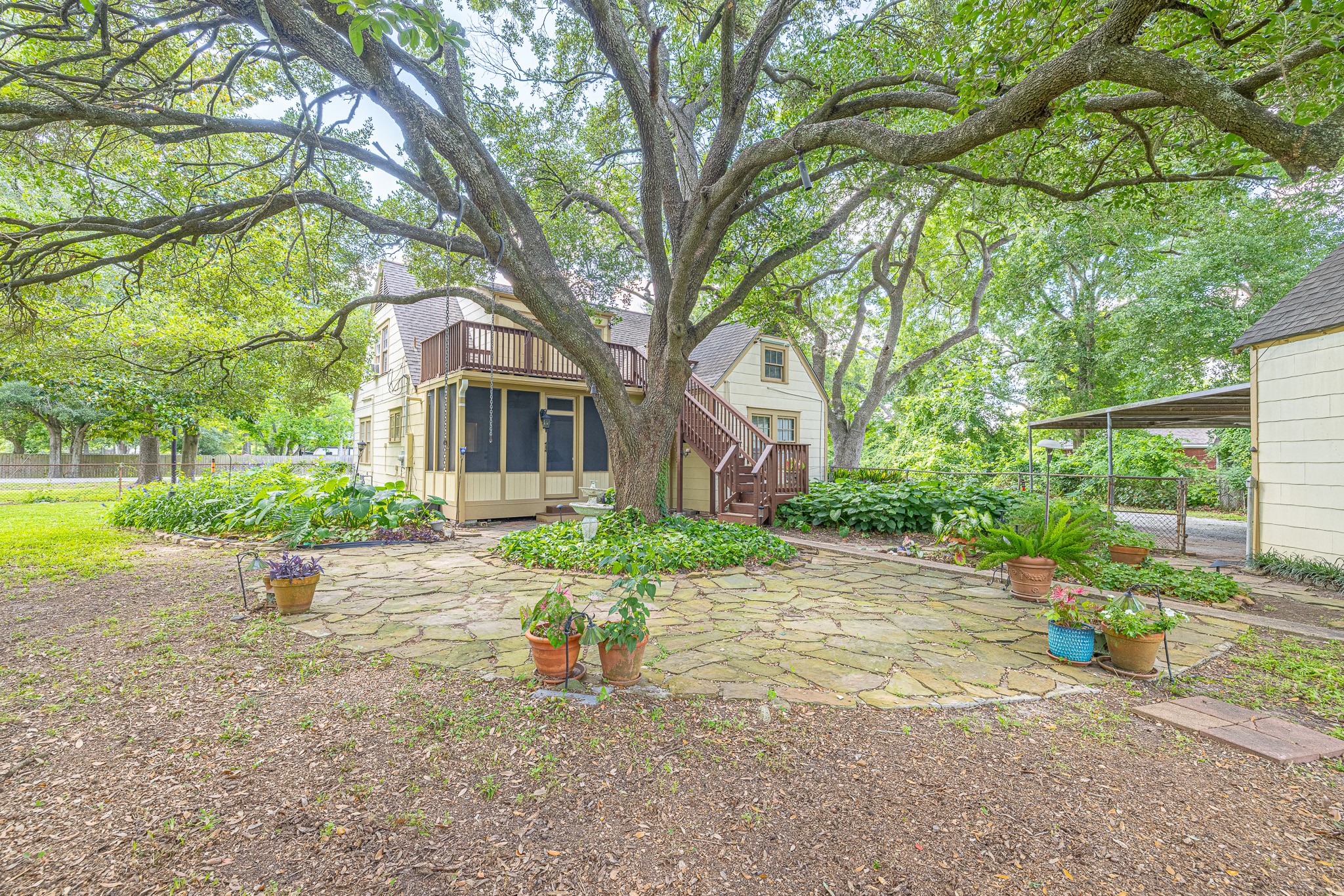 8548 Findlay Street Houston, TX 77017 - Photo 38 of 50 a front view of a house with a yard and potted plants