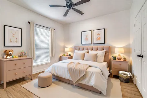 a bedroom with bed and window
