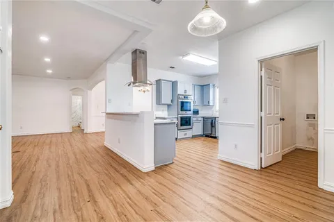 a view of kitchen and wooden floor