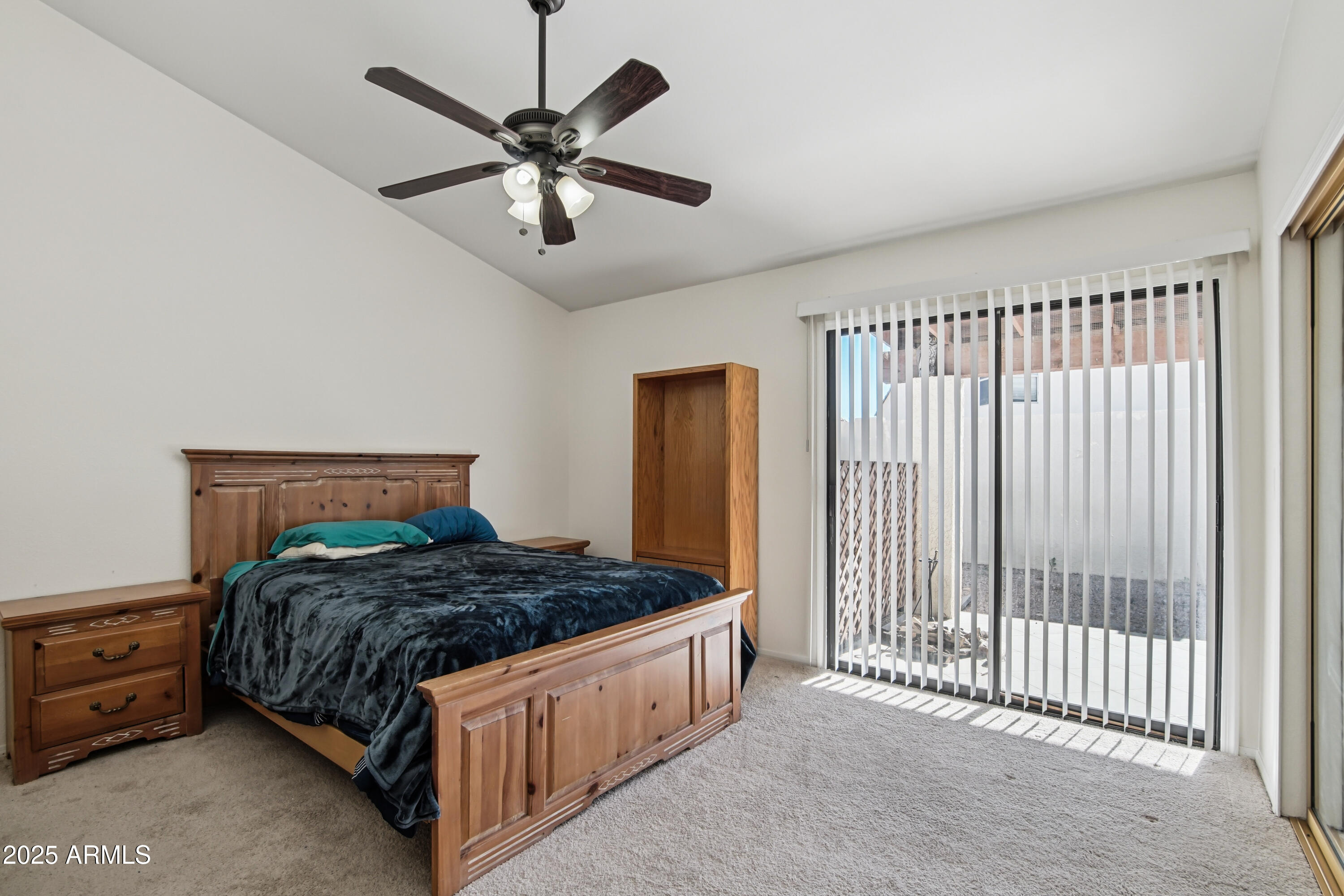 542 South Higley Road, Unit 89 Mesa, AZ 85206 - Photo 13 of 30 a bedroom with a bed and a ceiling fan