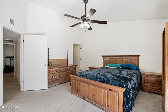 a bedroom with a bed and a dresser