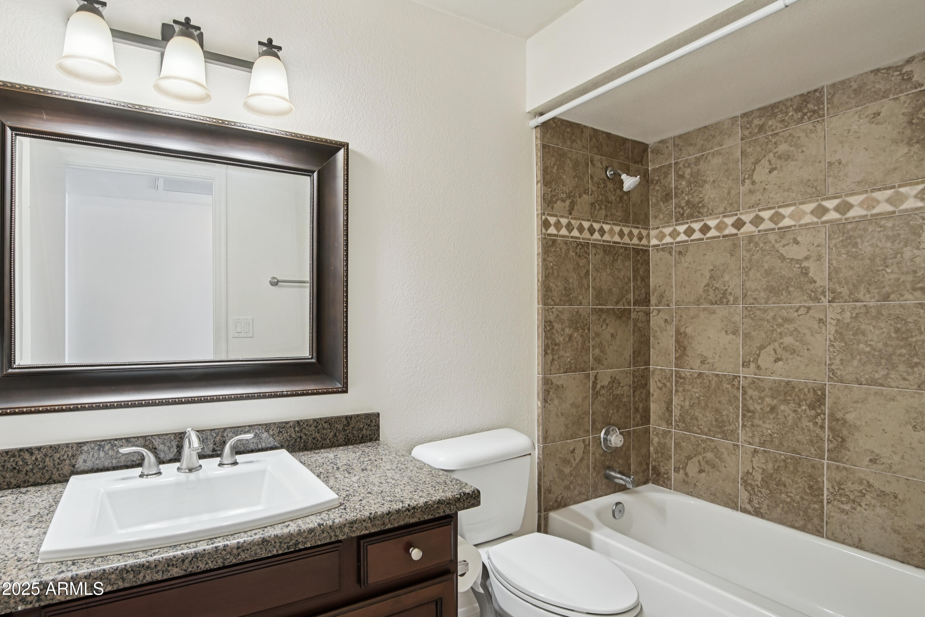 542 South Higley Road, Unit 89 Mesa, AZ 85206 - Photo 17 of 30 a bathroom with a granite countertop sink toilet and shower
