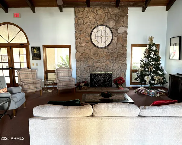 a living room with lots of furniture and a clock