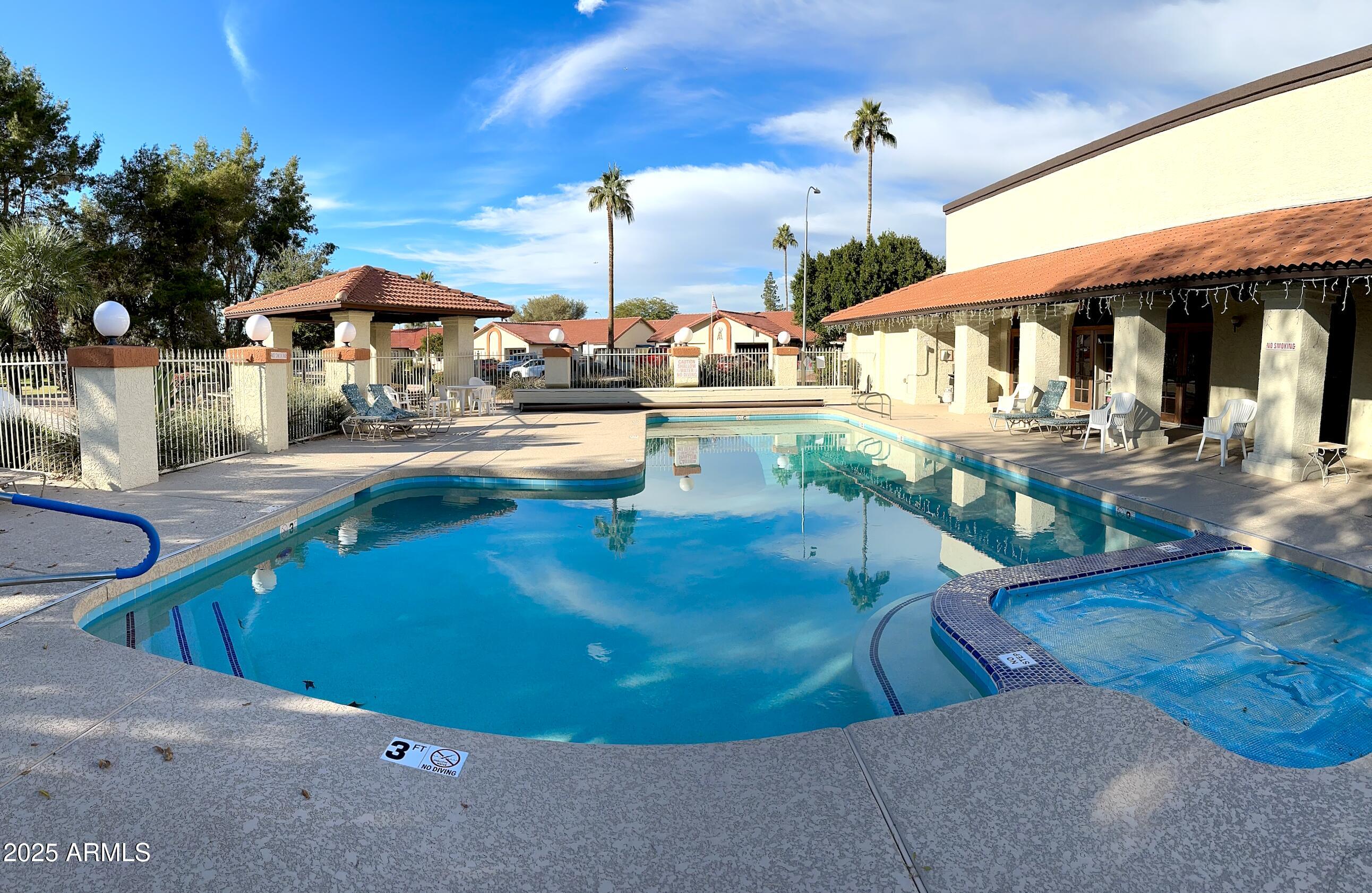 542 South Higley Road, Unit 89 Mesa, AZ 85206 - Photo 29 of 30 a view of a swimming pool with a patio