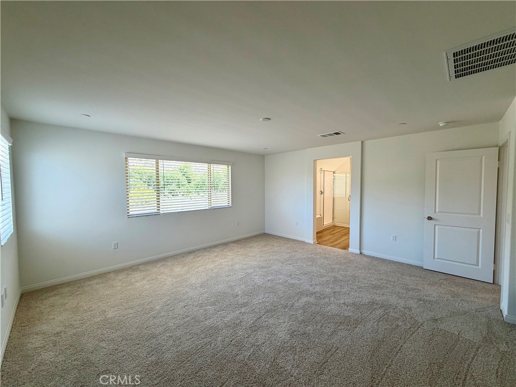 21624 Thomas Court Riverside, CA 92507 - Photo 19 of 36 an empty room with windows