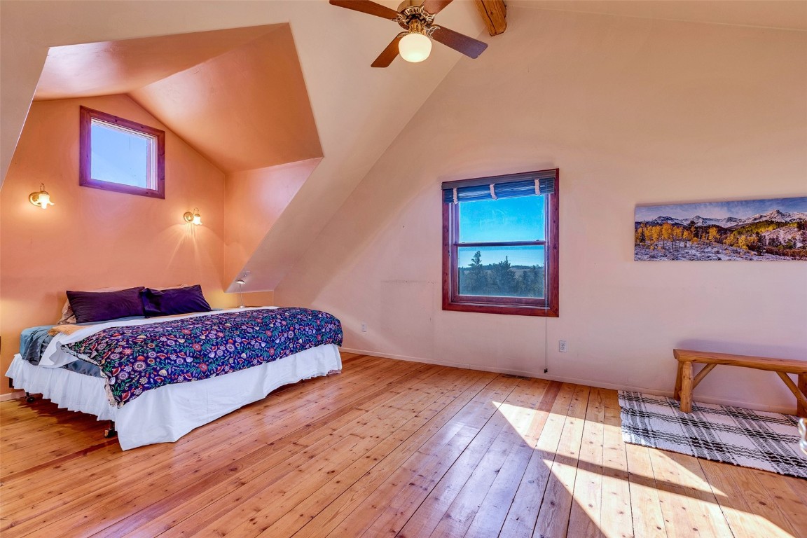 1528 Silver Heels Road Fairplay, CO 80440 - Photo 13 of 50 a bedroom with a bed and wooden floor