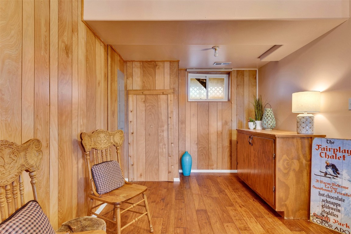 1528 Silver Heels Road Fairplay, CO 80440 - Photo 23 of 50 a view of a hallway with wooden floor and staircase