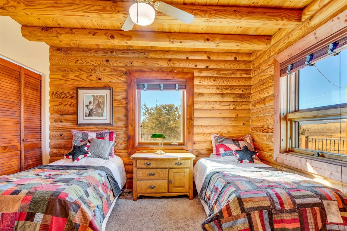 1528 Silver Heels Road Fairplay, CO 80440 - Photo 27 of 50 a bedroom with a bed and a window