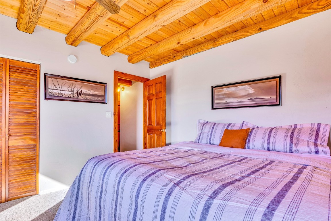 1528 Silver Heels Road Fairplay, CO 80440 - Photo 31 of 50 a bedroom with a bed and a painting on the wall