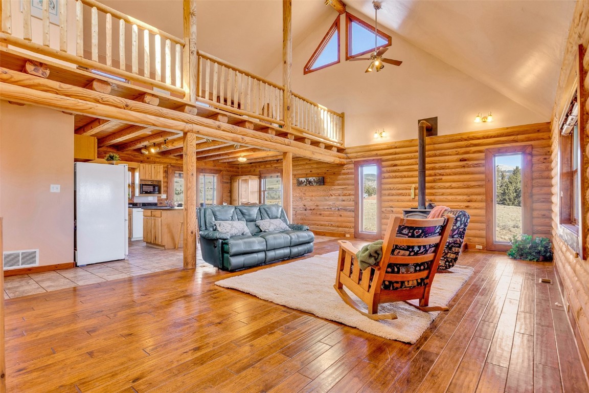 1528 Silver Heels Road Fairplay, CO 80440 - Photo 6 of 50 a view of a living room with furniture and wooden floor