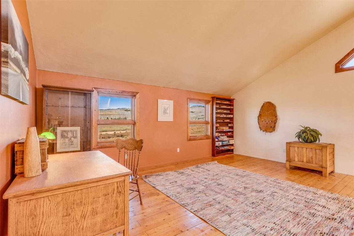 1528 Silver Heels Road Fairplay, CO 80440 - Photo 9 of 50 a bedroom with a bed and window