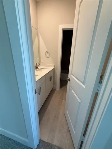 a kitchen with a sink a counter top space stainless steel appliances and cabinets