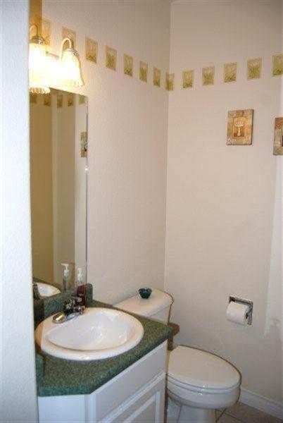 660 Shadow Way Central Point, OR 97502 - Photo 15 of 18 a bathroom with a sink a toilet and mirror