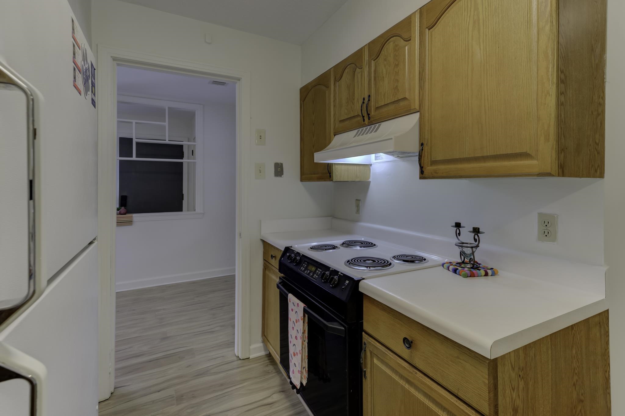 5077 New Castle Road Memphis, TN 38117 - Photo 13 of 37 a kitchen with a sink cabinets and appliances