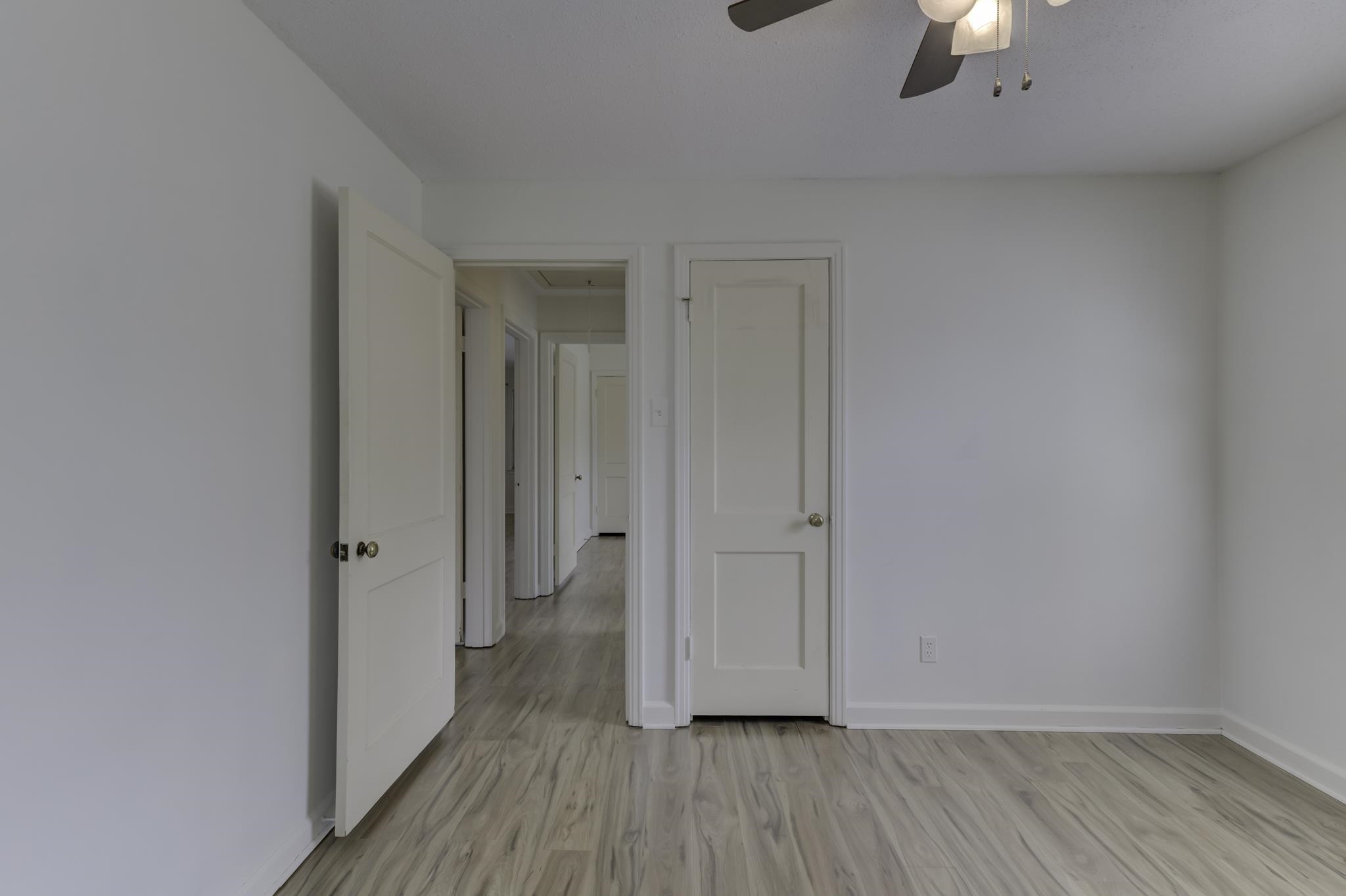5077 New Castle Road Memphis, TN 38117 - Photo 29 of 37 wooden floor in an empty room